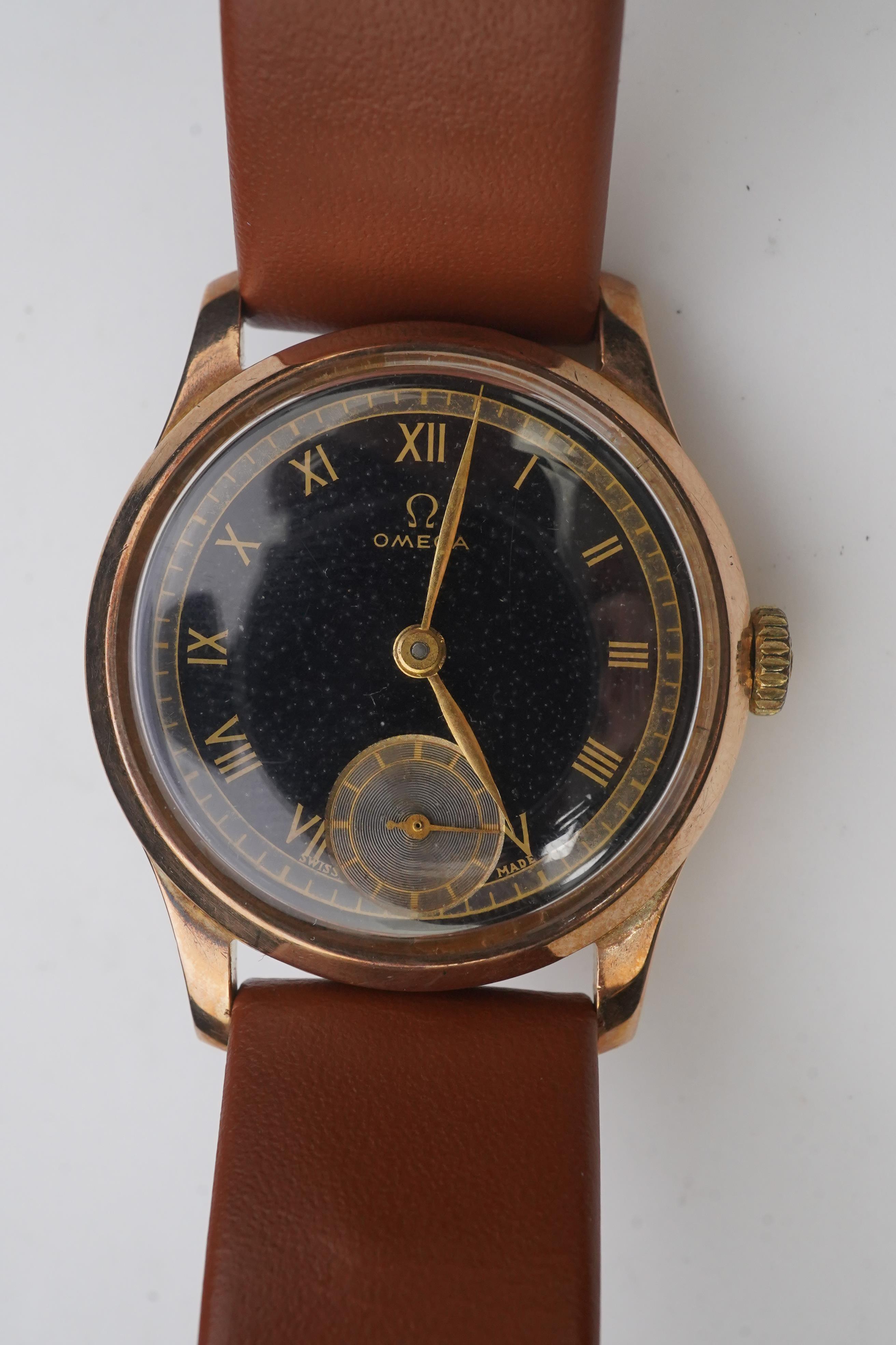 A gentleman's 1940's 9ct gold Omega manual wind wrist watch, on a later associated leather strap